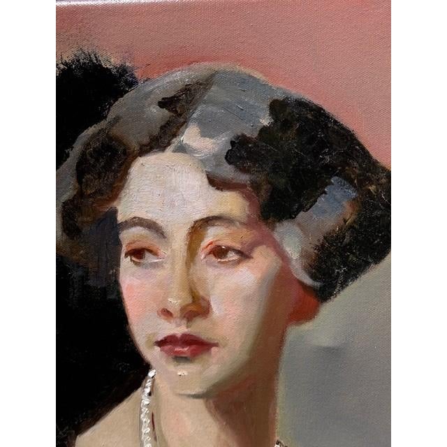 “A Lady in Pearls” is an elegant and introspective oil portrait that captures a quiet moment of refined grace. The...