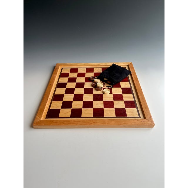One-of-a-Kind Heirloom Quality Double-Sided Wood Game Board Checkers & Word Game This double-sided game board is...