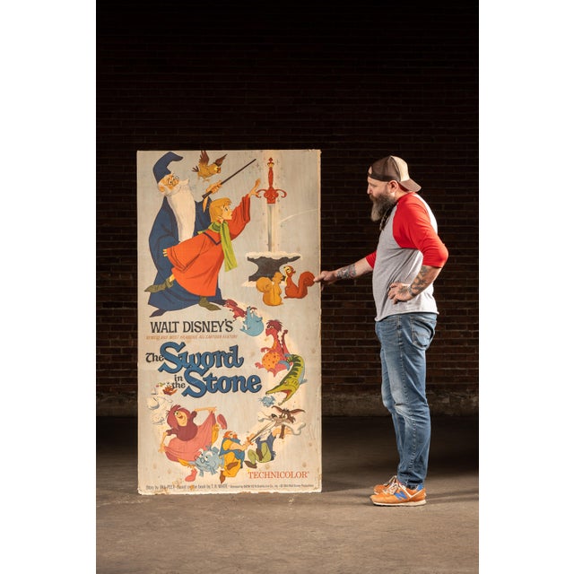 An original double-sided posterboard advertising for Disney's Sword In The Stone (1963) and the 1973 musical Tom Sawyer...