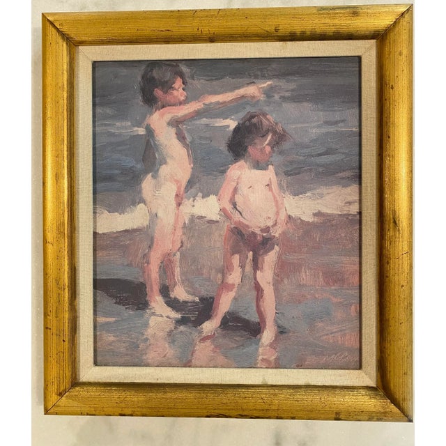 Late 20th century framed oil painting on board of children playing at the beach by Dan McCaw. Beautiful muted blues, pinks...