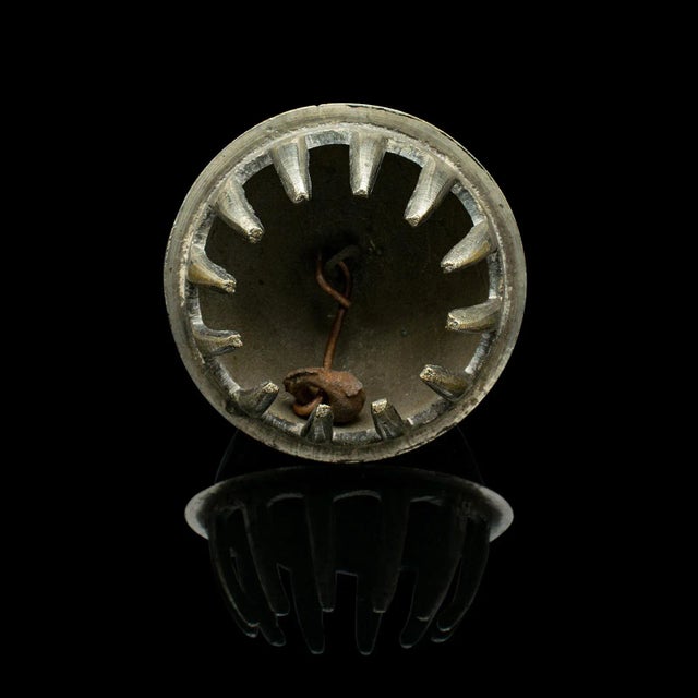 This is an antique tea calling bell. A Japanese, brass and silver plate decorative chime, dating to the early 20th...