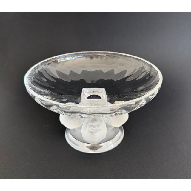 Designed by Marc Lalique in 1966, this classic piece features a clear glass bowl supported by a base with four frosted...