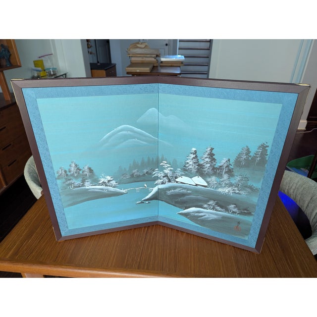 An exquisite, authentic mid-century Shōwa-era Japanese Byōbu (folding table screen) featuring a serene, hand-painted...