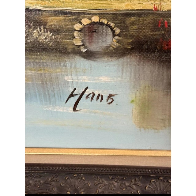 This exquisite painting depicts a serene landscape with a quaint cottage nestled by a river. The piece is meticulously...