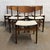 A set of six Danish teak dining chairs attributed to Erik Buch, dating to the 1960s. The chairs have a light, sculptural...
