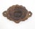 Baroque style furniture applique made of brass. It features ornate acanthus leaf scrolls framing a central fan-shaped...