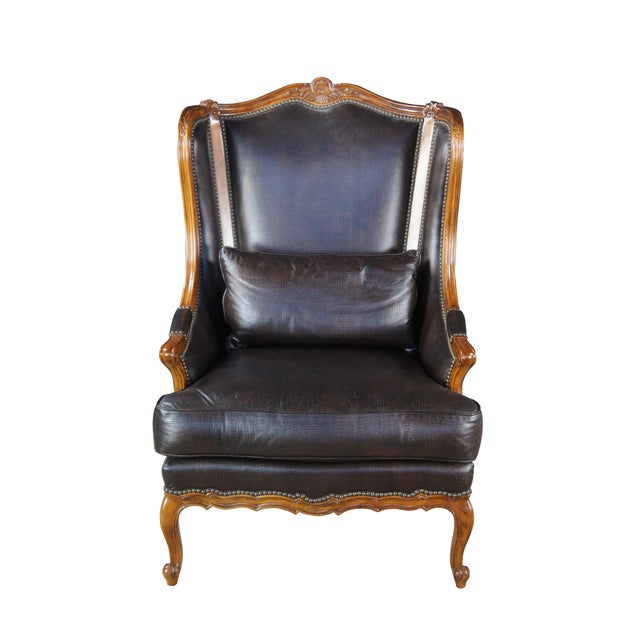 Vintage Thomasville wingback bergere arm chair featuring faux alligator leather upholstery and nailhead trim. Includes...