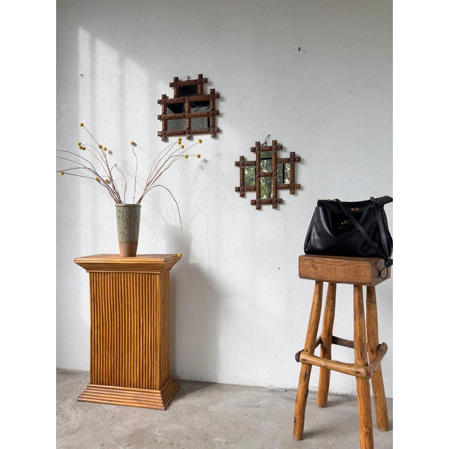 A vintage pair of tramp art frames from the 1900s, repurposed as mirrors. we love the craftsmanship, the diamond-point...