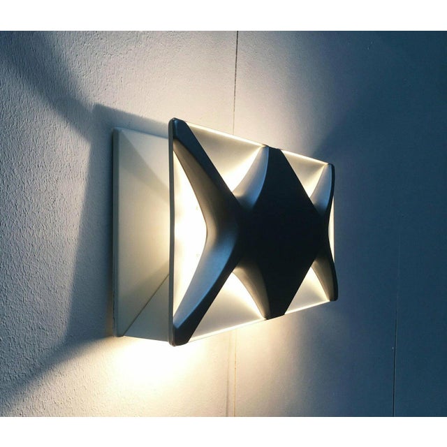 Rare wall lamp from Heinz Neuhaus Leuchten based on a design by Klaus Link from the 1960s. Due to the formal similarity to...