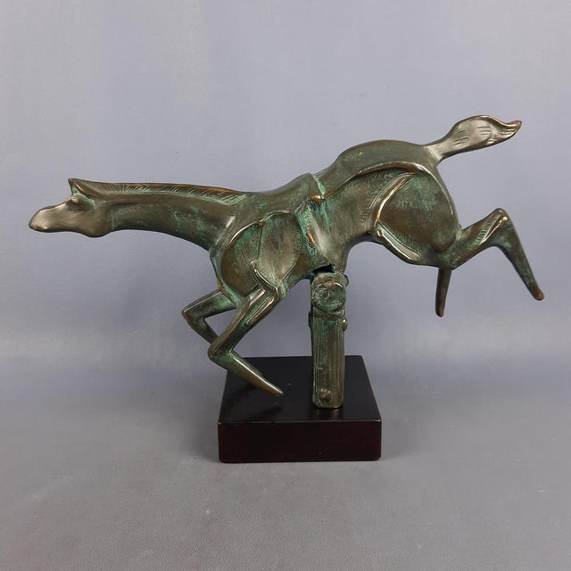 Stunning vintage sculpture, depicting a stylized show-jumping horse, made of burnished brass on a wooden base, excellent...