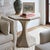 The Hourglass Table’s stone top is crafted of Crema Marfil marble, a material with unique and handsome variations. It is...