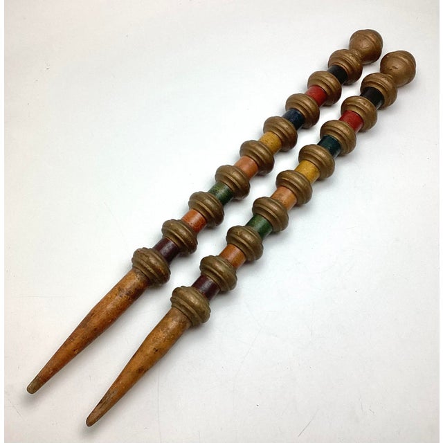 Antique Turned Wooden Croquet Stakes in Wonderfull Old Paint. Each measures 24 inches and are 2 inches in diameter. They...