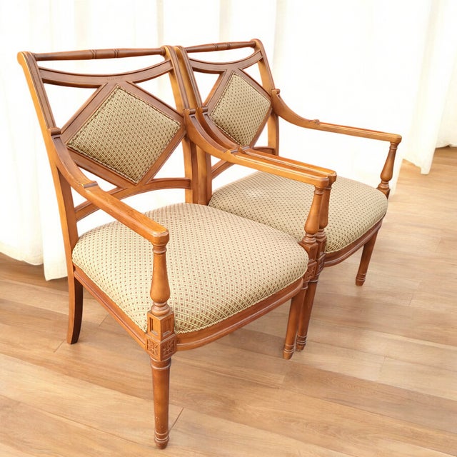 Introducing a stunning pair of Georgian-style armchairs, reminiscent of late 18th century England. Crafted from turned...