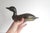 Vintage brass duck decoy bank. This is heavy and has lots of patina and some spots of corrosion. There is felt on the...