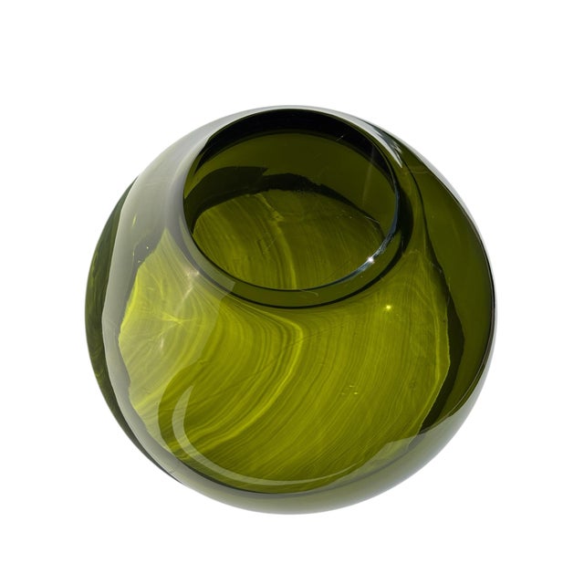 Very heavy hand blown large glass bowl in beautiful green.