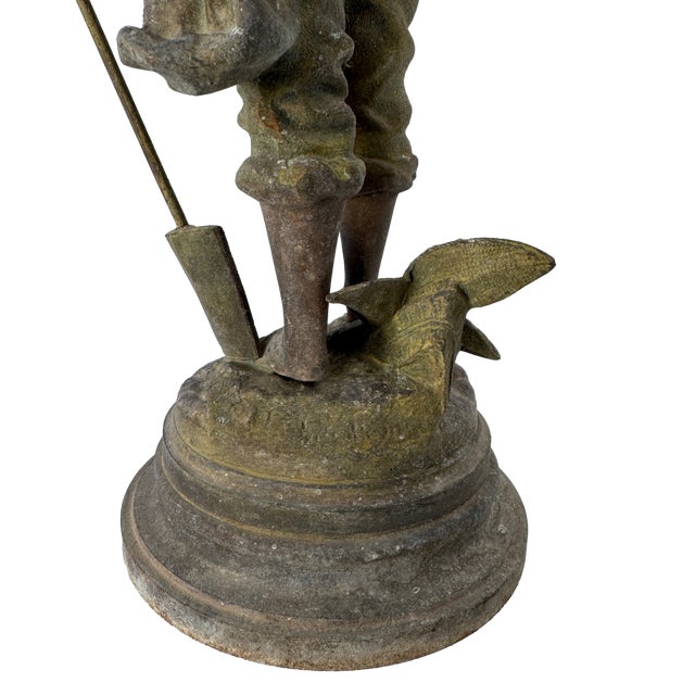 A striking antique French figural sculpture by Louis Guillemin, depicting a young gardener, or Jardinier. Standing an...
