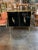 Extremely elegant modern black glass and brass side table. Super polished look for an upscale home. Beautiful brass...