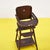 Discover this charming vintage high high chair, perfect for adding a touch of nostalgia to your home. Crafted from wood,...
