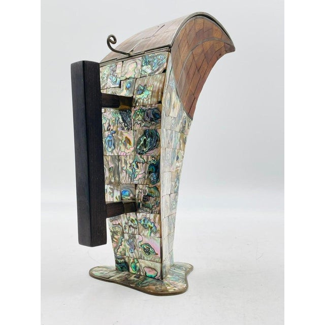 A striking Mid-Century Modern Mexican pitcher designed and handcrafted in the 1950s by Jeronimo Fuentes in Taxco,...