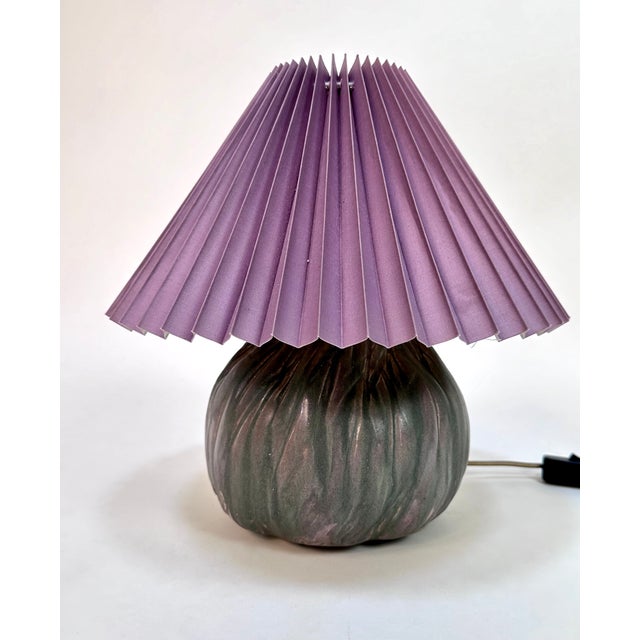 This hand-crafted ceramic table lamp was created at a german ceramist workshop during the 1960s. The high-quality lamp...
