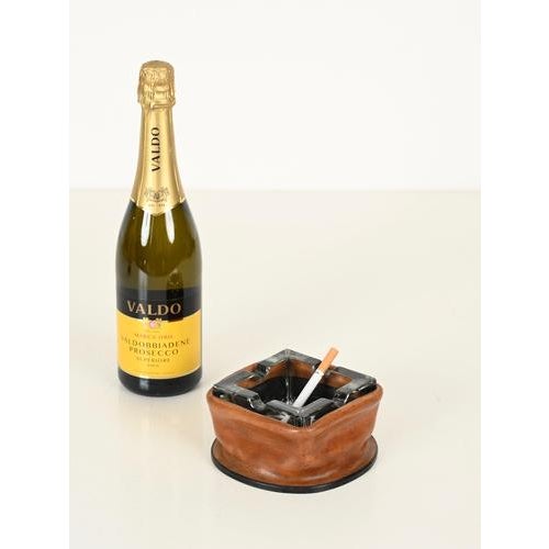 Delightful Italian ashtray in thick hand-molded leather and crystal. The design of this incredibly stylish piece is...