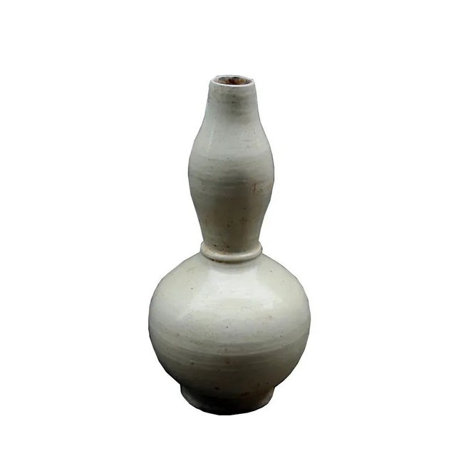 This hand made vintage style pottery is in off white color and has an earthy look. Made in the 2010s in the style of Asian...