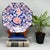 Striking octagonal ceramic platter by Toyo Japan, with pink peonies at the center and bird-and-flower medallions around...