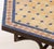 Moroccan Zellige Tile Top Hexagonal Table, the blue and pink tile top above wrought iron base on four down swept legs....