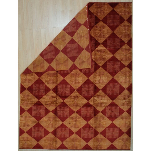 Opulent Classic Coral Hand Knotted Afghan Wool Rug, Country of Origin: India. This exceptional piece, though produced in...