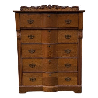 Antique Victorian Oak Serpentine Front Five-Drawer Highboy Dresser With Ornate Carved Crest For Sale