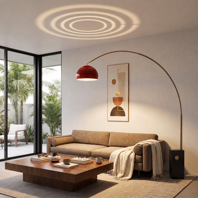 The Iconic Arc Lamp is a mid-century modern masterpiece, featuring a weathered brass steel body and a striking crimson red...