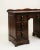 Rich in character and craftsmanship, this Colonial Revival writing desk features a warm mahogany-toned finish, a...