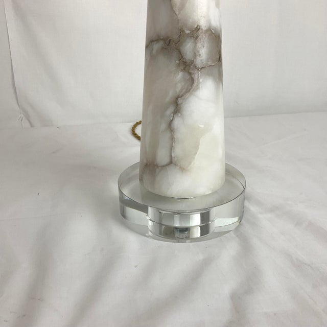 Brighten your home with this stylish table lamp, designed with a beautiful marble‑look base and a classic white shade. Its...