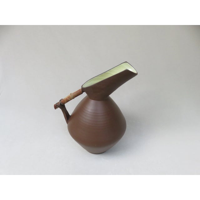 A large jug, ceramic vase, terracotta from the 50s, labeled: handmade 71/40, a studio ceramics. The jug is in its details...