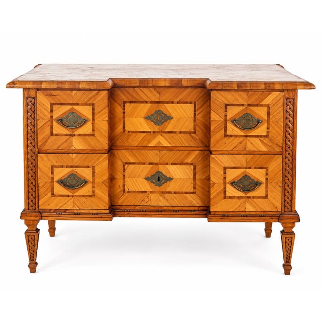 A beautiful German Louis XVI period commode, circa 1780, distinguished by its unusually graphic parquetry and finely...