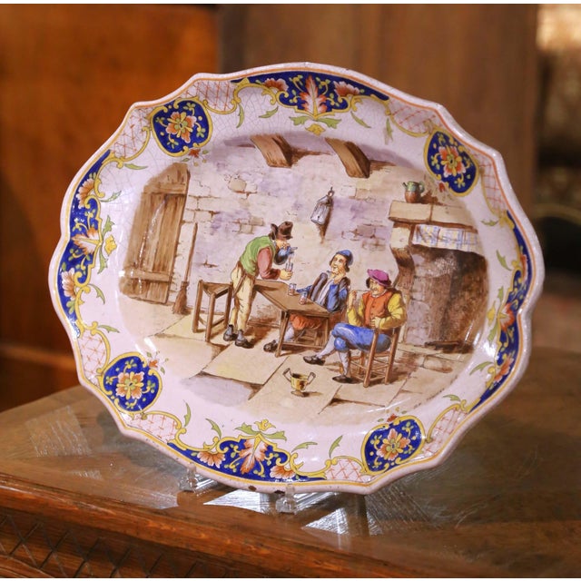This antique French faience platter was produced in northern France, likely in Desvres, circa 1880, and is decorated with...