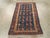 This Early 20th century Central Asian Soumak rug, measuring 1' 11" x 3' 2", exemplifies the refined artistry and rich...