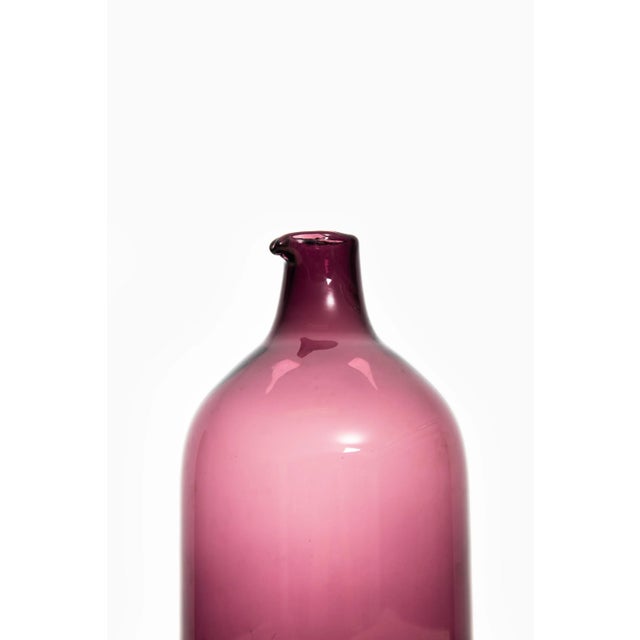 Glass bottle or vase model Pullo or Bird vase designed by Timo Sarpaneva. Produced by Iittala in Finland. This piece is...