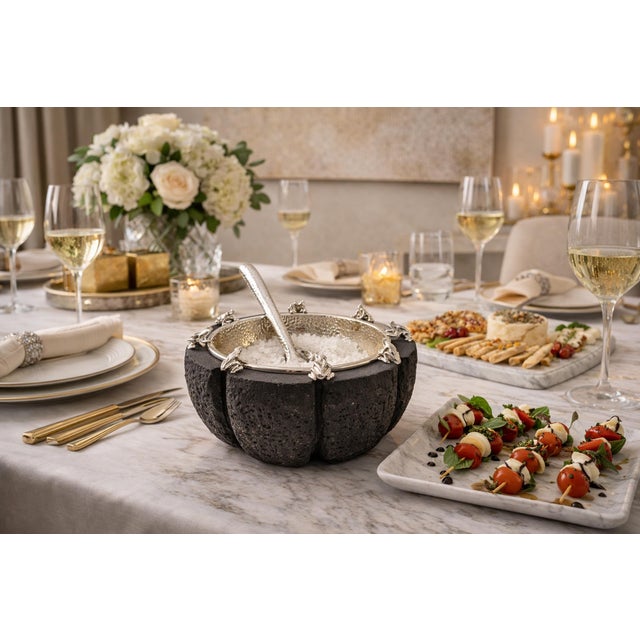 Striking and sculptural serving bowl / molcajete designed by renowned Taxco silversmith Emilia Castillo, masterfully...