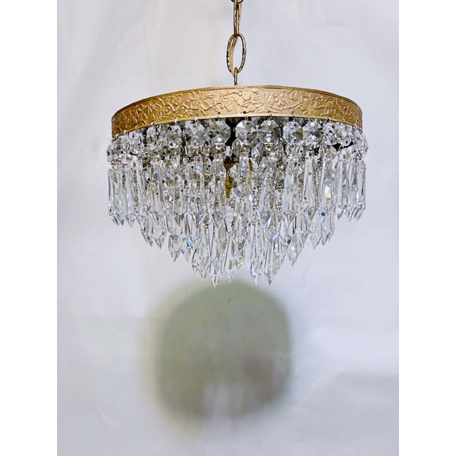 Make a grand statement in spaces with lower ceilings with this magnificent vintage mid-century tiered brass waterfall...