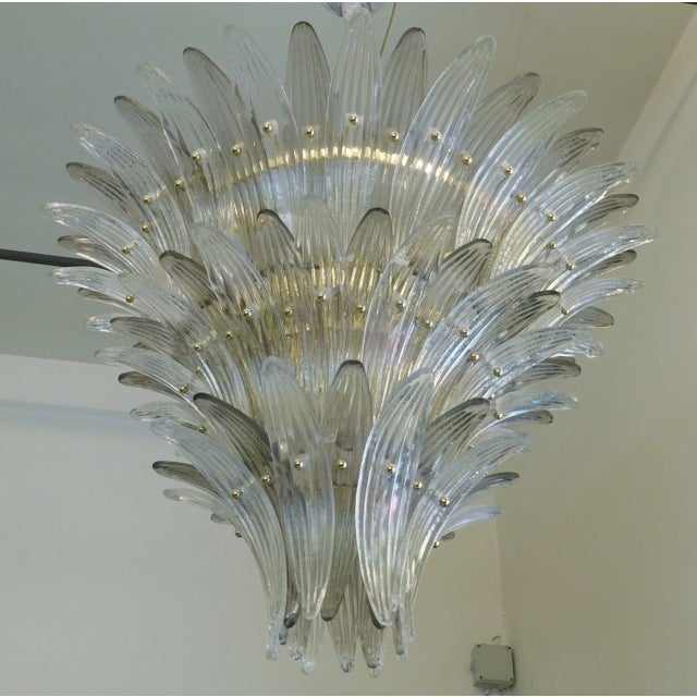 Italian Palmette chandelier with clear and smoky Murano glass leaves mounted on gold finish metal frame / Made in Italy...