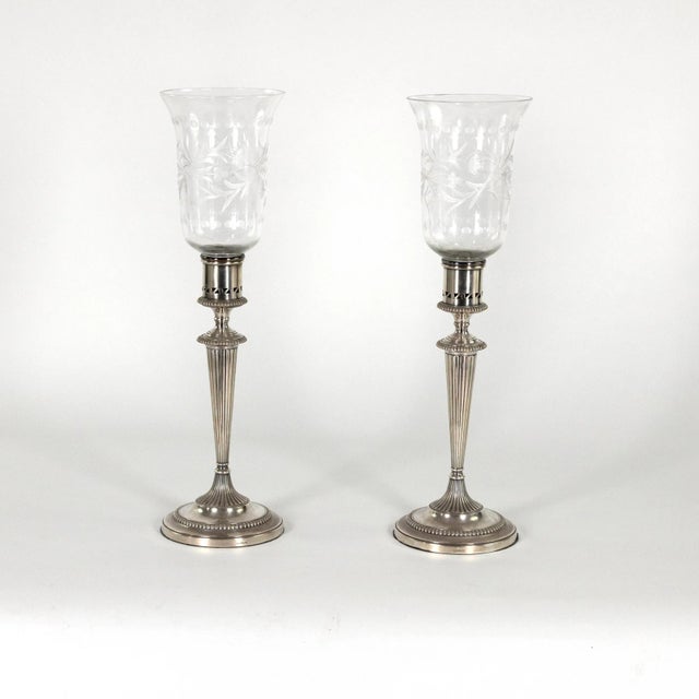 A pair of handsome Sheffield silver plate candlesticks with etched glass hurricanes, marked Blagden, Hodgson and Company...