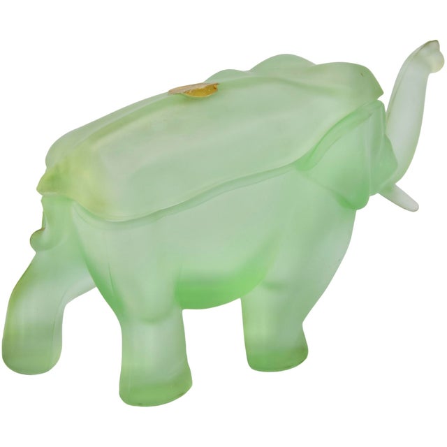 Beautiful midcentury handblown green heavy-glass elephant figurine candy jar. Exhibiting an elegant sleek and textured...