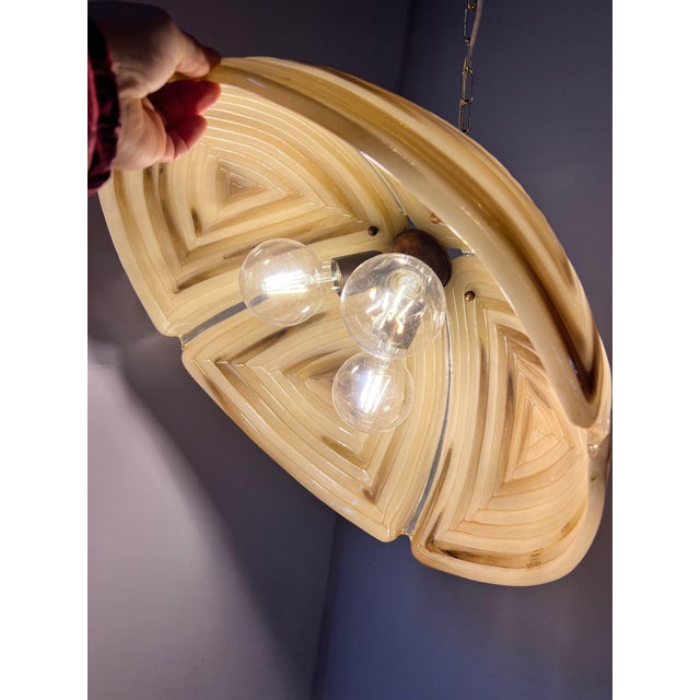 This pendant lamp from the Cristallux manufactory is a captivating lighting object from the Space Age era, distinguished...