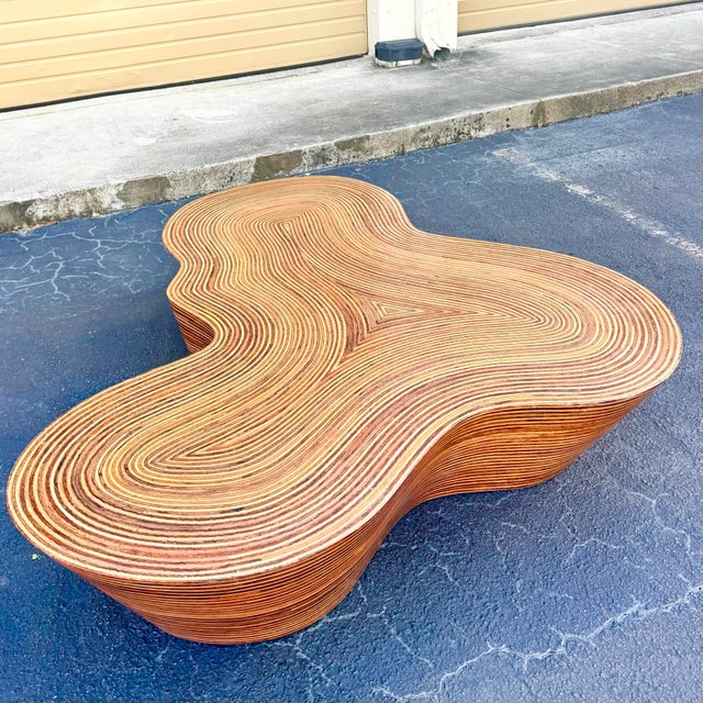 This sculptural Boho Chic “Orgo” coffee table by Oggetti features a mesmerizing organic silhouette crafted from tightly...