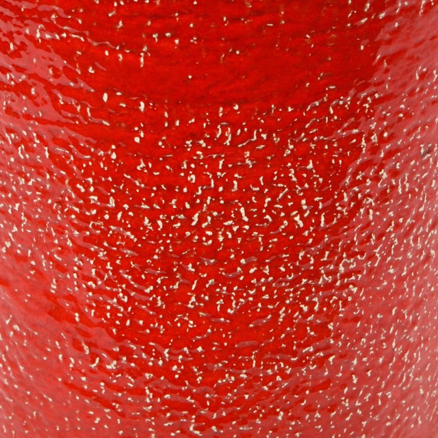 This refined Mid-Century Modern umbrella stand was realized in Italy, circa 1960. It features a cylindrical body with an...