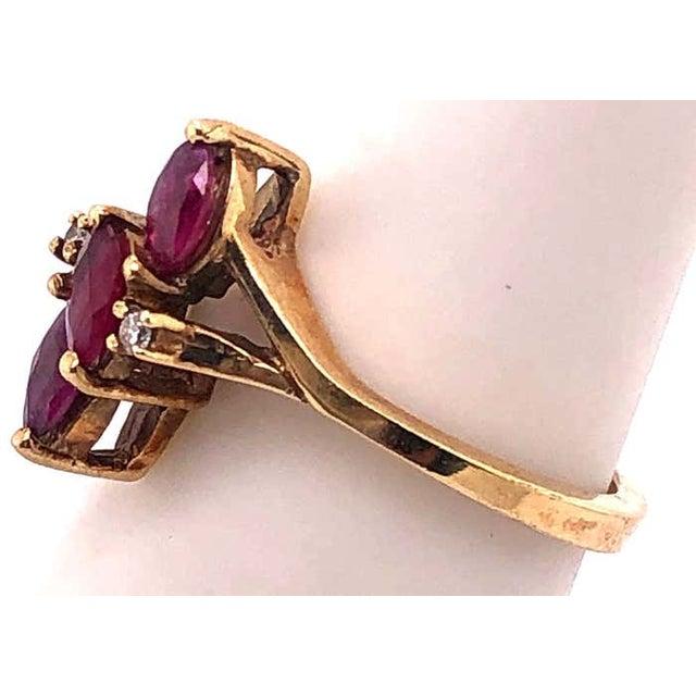 14 Karat Yellow Gold Free Form Ruby With Diamond Accent Ring Size 5.5 Size 5.5 2.80 grams total weight.