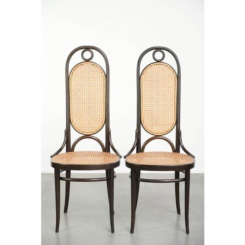 Set of 6 original vintage Thonet Long John chairs with a high back, webbing seat and backrest, and elegantly curved wood....