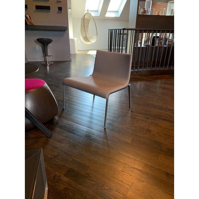 Beautiful Zoa chair designed by Pascal Morgue for Ligne Roset. Minimalistic Ligne Roset lounge chair, in beautiful medium...
