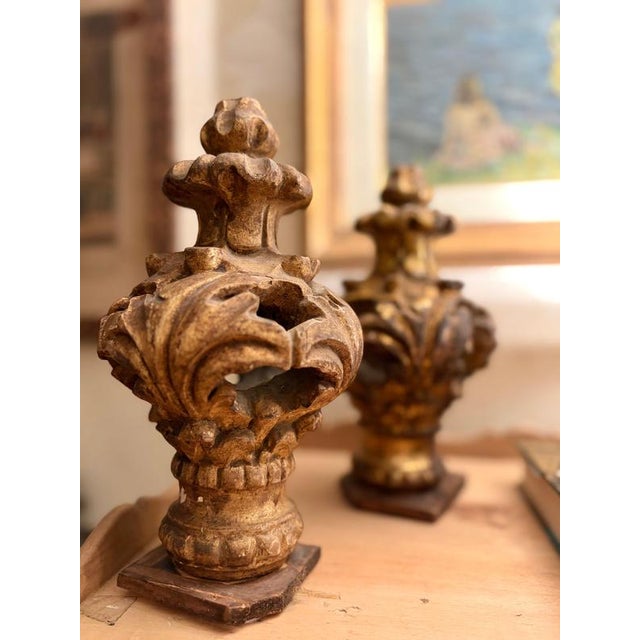 An exquisite pair of hand-carved and gilded wood finials dating to the louis xv period, circa 1740–1760. Masterfully...
